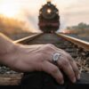 Black Celtic tungsten mens ring on railway worker