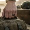 Black tungsten mens ring with rose gold on tactical worker