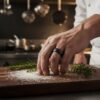 Textured black titanium ring on chef